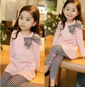 Girl's pink cotton clothing set with long sleeve top and trousers in children's sizes