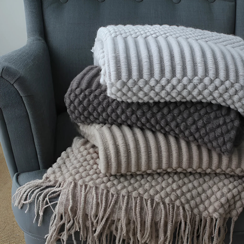 Small polyester nap blanket in dark grey, khaki, or light grey measuring 127x170cm