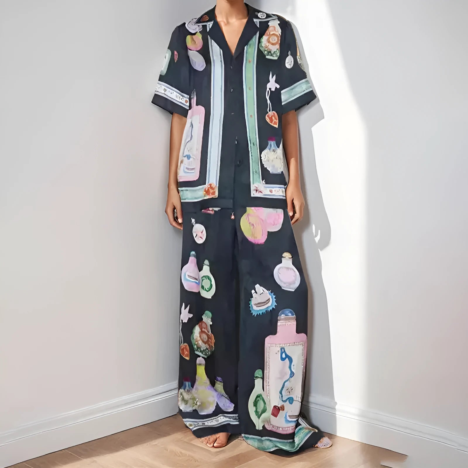 Black women's cartoon print polyester lounge set with cardigan sleeve top and matching trousers