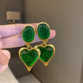 Silver needle pleated oval love heart stud earrings in purple, red, green, and yellow/white alloy colours.