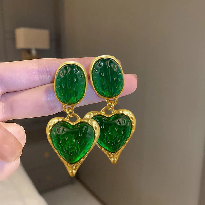 Silver needle pleated oval love heart stud earrings in purple, red, green, and yellow/white alloy colours.