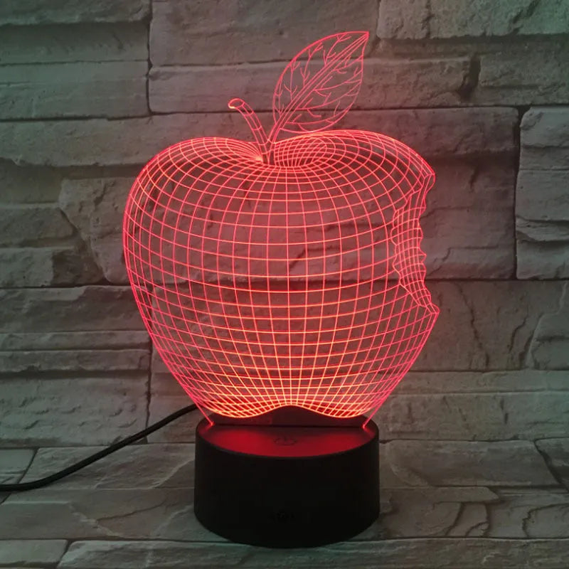 3D fruit-shaped night light with colourful LED glow and touch controls on a table.