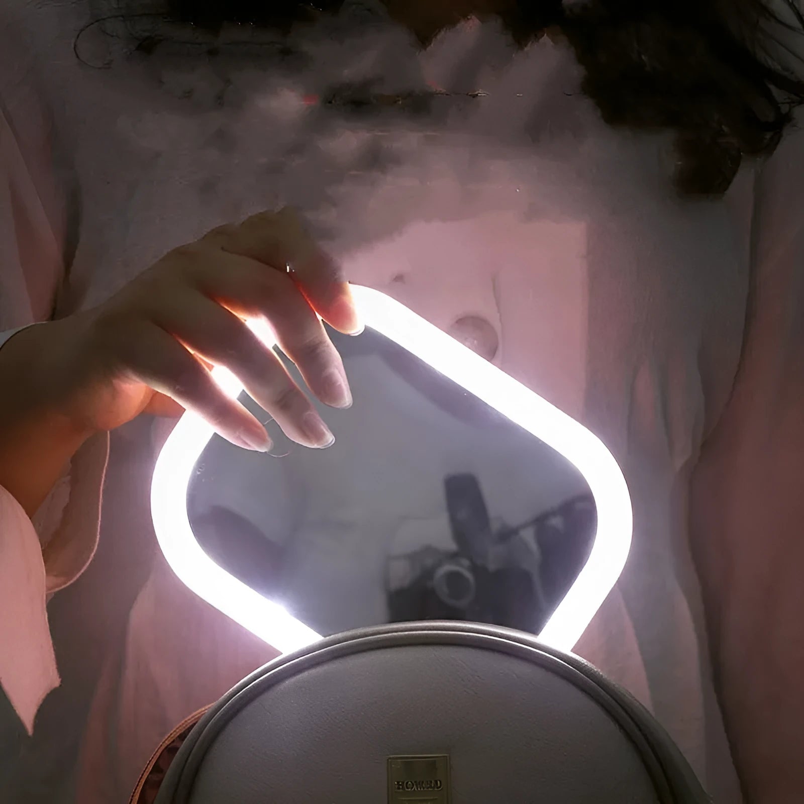 Desktop mirror with fill light and five times lens on a bathroom vanity countertop