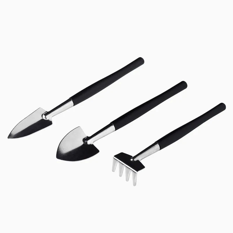 Black miniature gardening tool set with 16 pieces including tweezers, shovels, watering bottle, and cushion for succulent care
