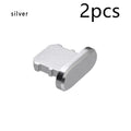 Aluminium alloy iPhone charging port dust plug in various colours on a white background.