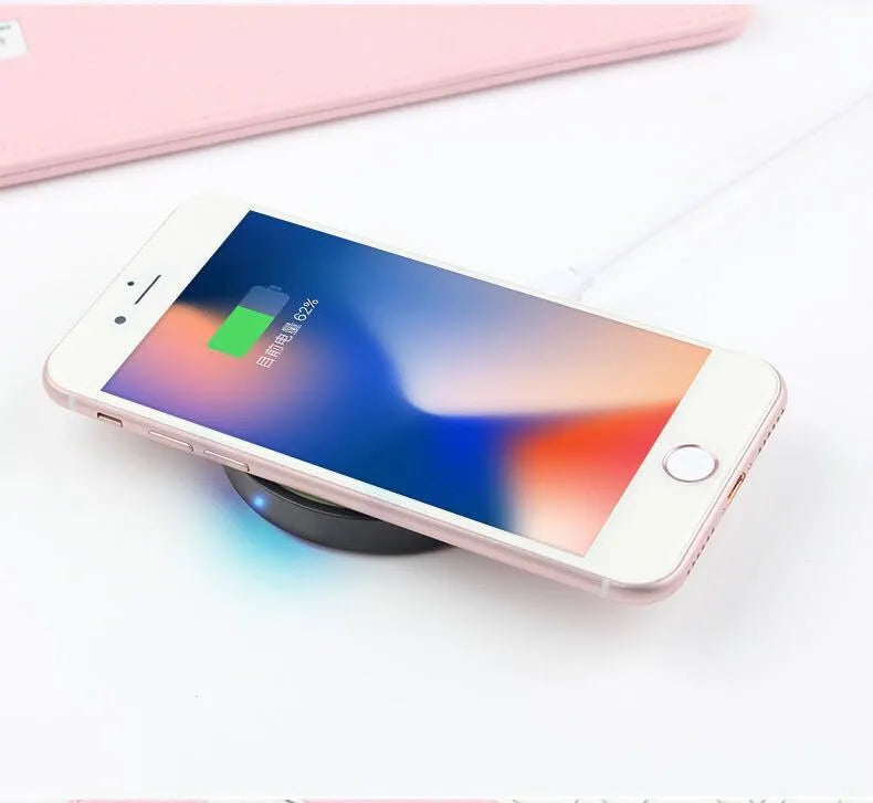 Square Qi wireless charging pad in one of six colours, showing compact 69mm size on a desk.