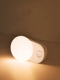 White rechargeable sensor night light with motion detection and LED illumination for bedroom use