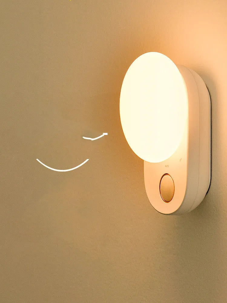 White rechargeable sensor night light with motion detection and LED illumination for bedroom use