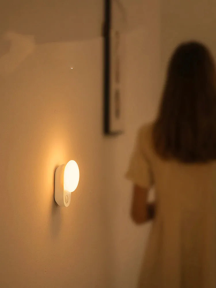 White rechargeable sensor night light with motion detection and LED illumination for bedroom use