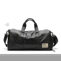 Large black PU leather sports training bag with multiple compartments showing laptop and camera pockets