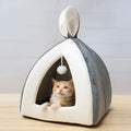 Grey cloth cat house with removable fleece interior cushion for cats or small dogs.