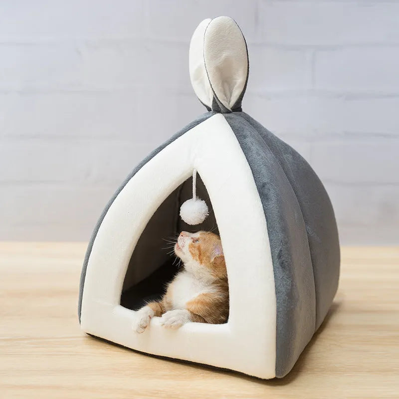 Grey cloth cat house with removable fleece interior cushion for cats or small dogs.