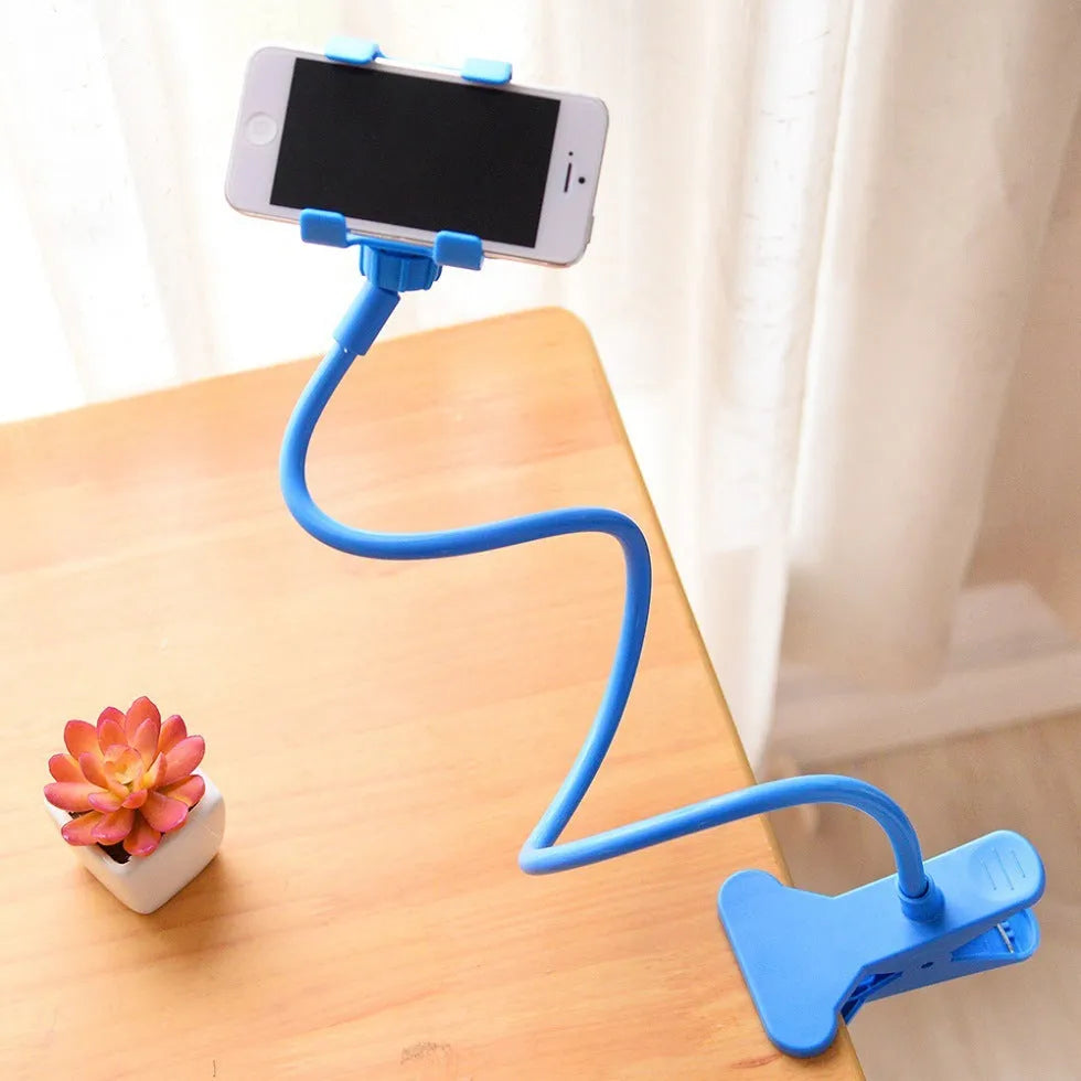 Black flexible long arm phone holder clipped to bed frame with smartphone mounted at adjustable angle