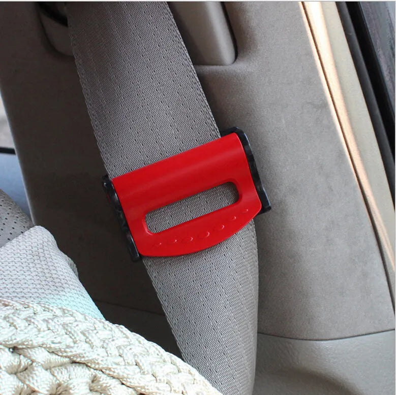 Pack of two black ABS plastic seat belt clips model SD-1401 in blister cardboard packaging