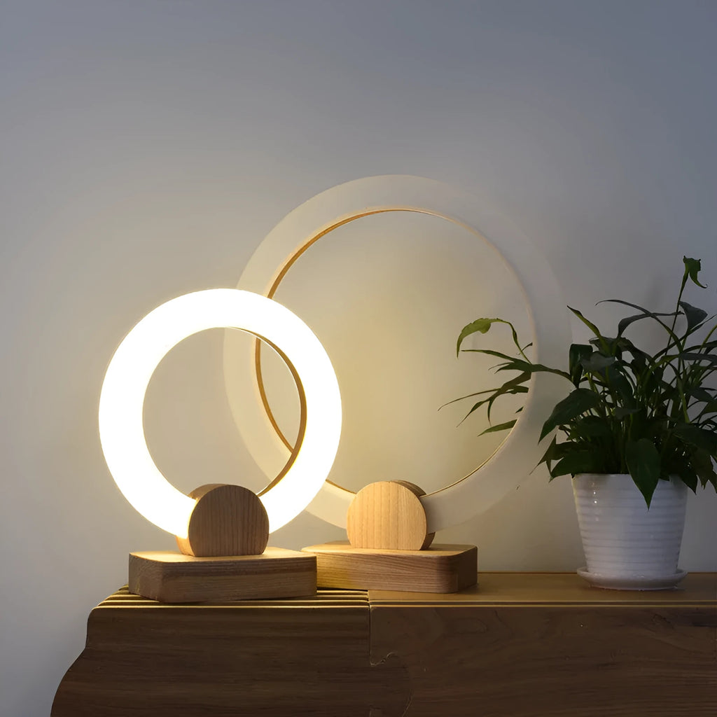 Modern wooden circular chandelier with a white acrylic shade hanging from a ceiling.