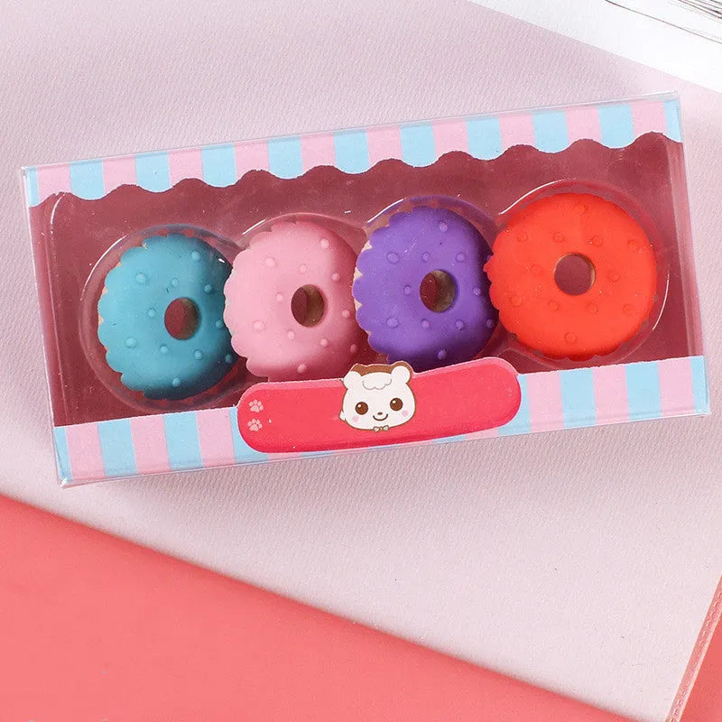 Three sets of cartoon food-shaped erasers for kindergarten children including ice cream cones, doughnuts, and lollipops