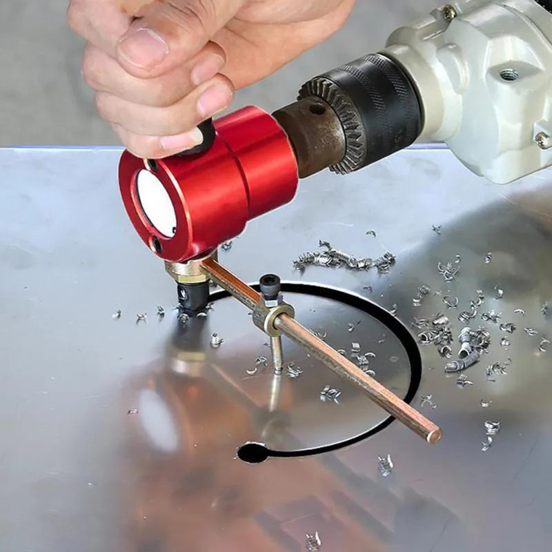 Red metal nibbler attachment with 360-degree head for cutting metal sheets using a drill