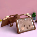 Brown cartoon-style silicone iPad case shown with integrated bracket stand deployed.