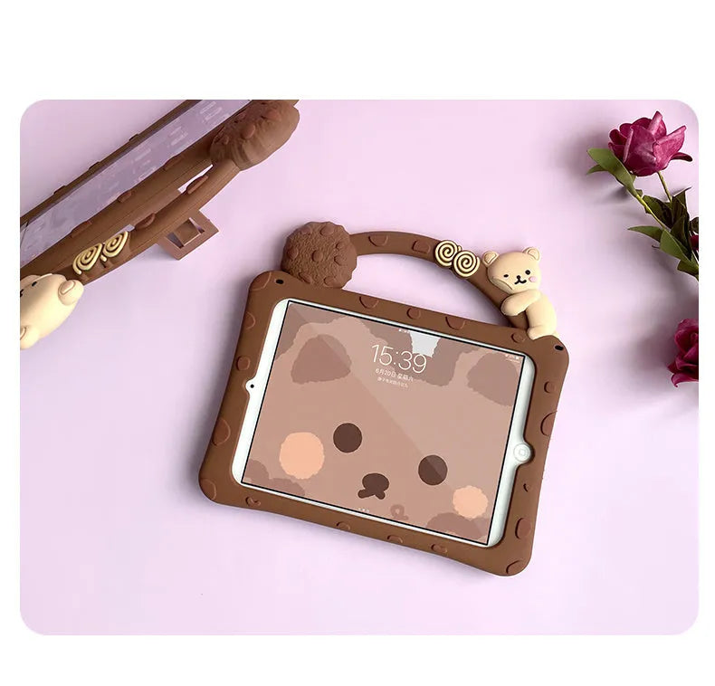 Brown cartoon-style silicone iPad case shown with integrated bracket stand deployed.