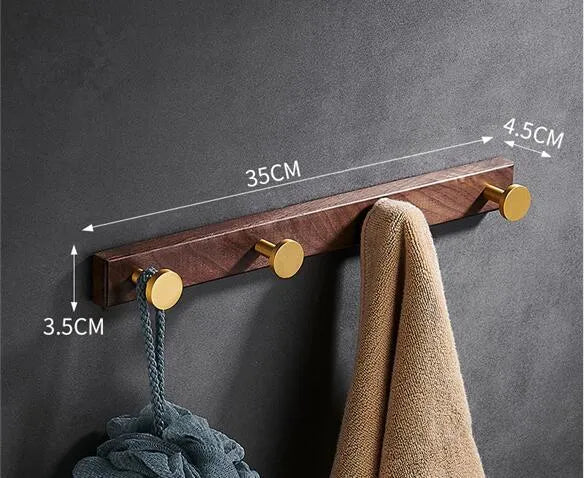 Black walnut aluminium clothes hooks with brass wire drawing finish on wall