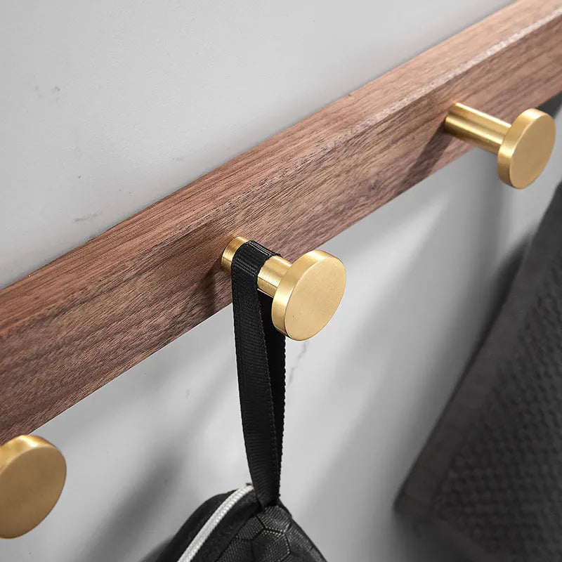 Black walnut aluminium clothes hooks with brass wire drawing finish on wall