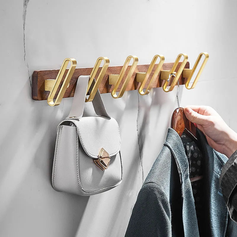 Black walnut aluminium clothes hooks with brass wire drawing finish on wall