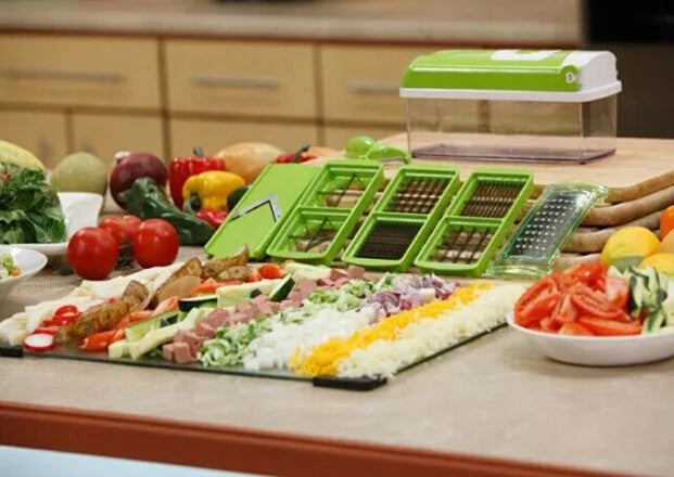 Green 12-piece multifunctional vegetable chopper set with stainless steel blades, manual handheld design, on kitchen countertop