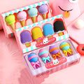 Three sets of cartoon food-shaped erasers for kindergarten children including ice cream cones, doughnuts, and lollipops