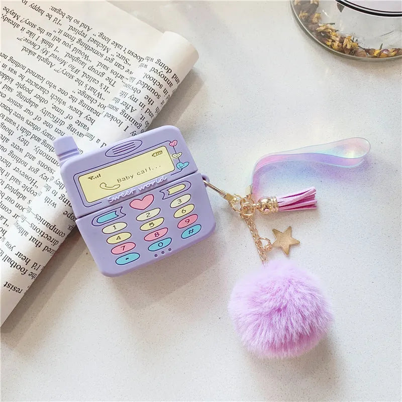 Purple silicone AirPods case with fur ball pendant accessory
