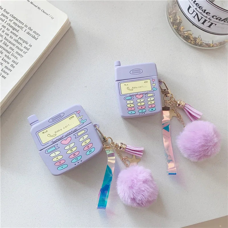 Purple silicone AirPods case with fur ball pendant accessory