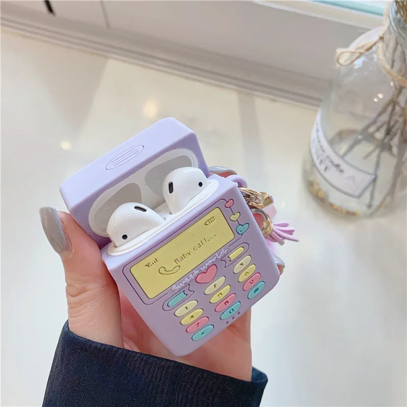 Purple silicone AirPods case with fur ball pendant accessory