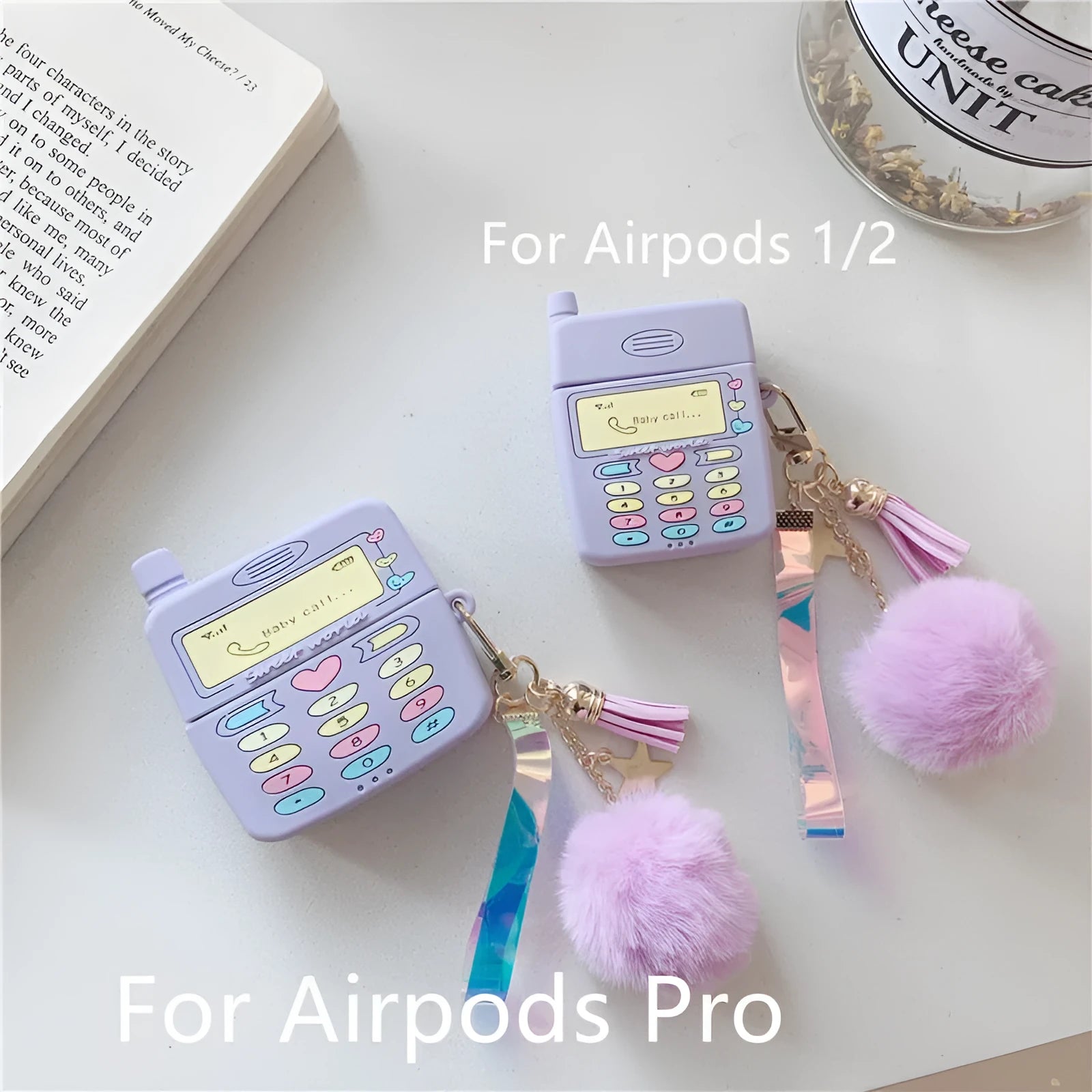 Purple silicone AirPods case with fur ball pendant accessory