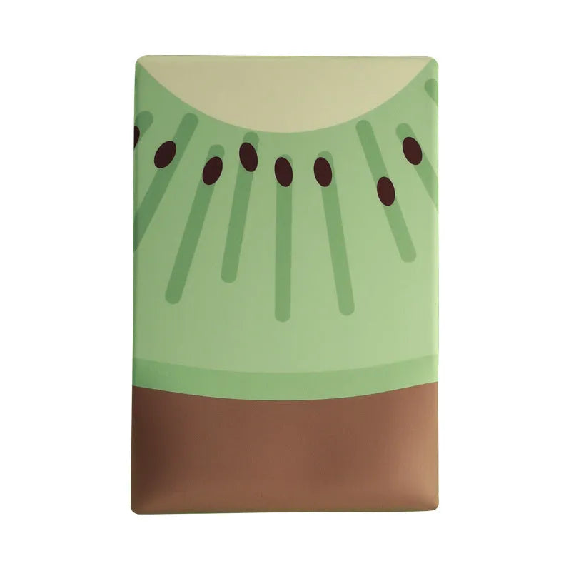 Green kiwi fruit shaped soft gel wrist support mouse pad on a desk.