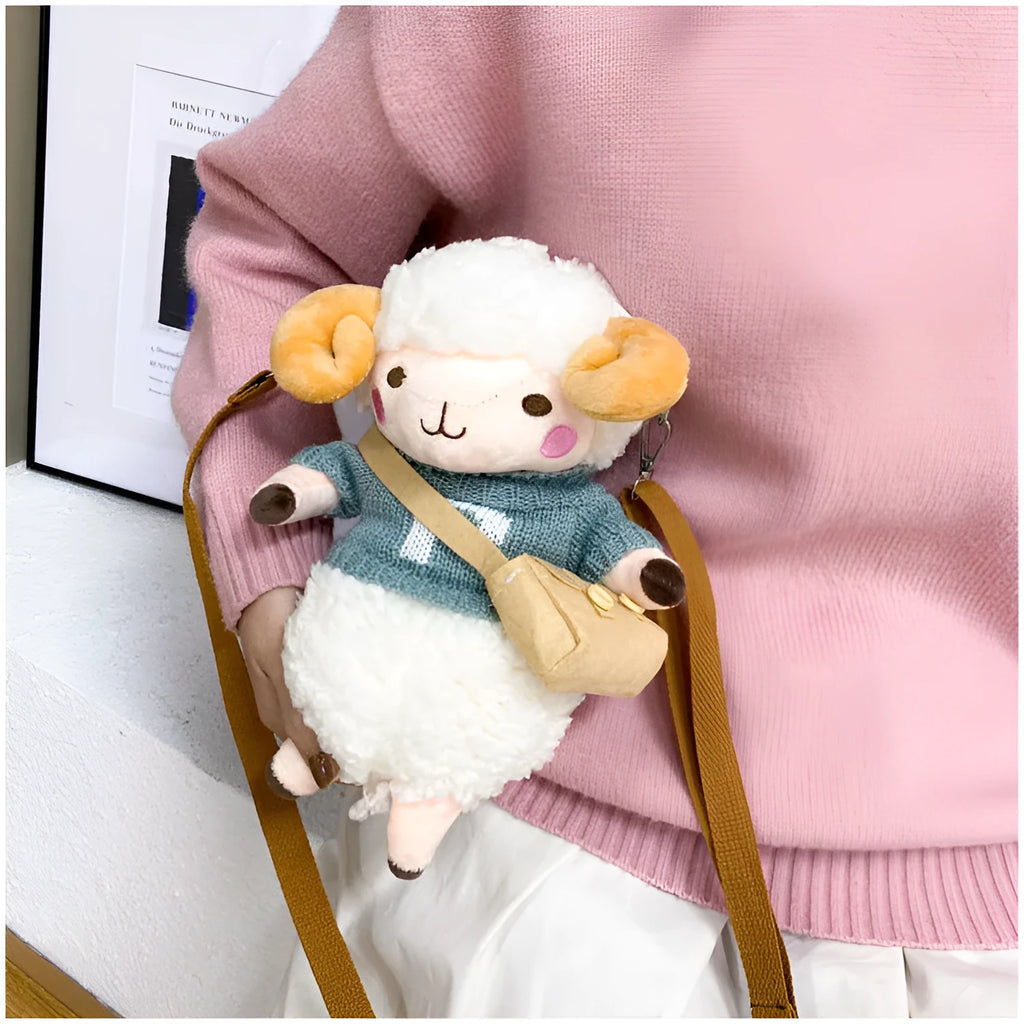 Little Sheep small square crossbody bag in blue plush fabric with a single shoulder strap and zip.
