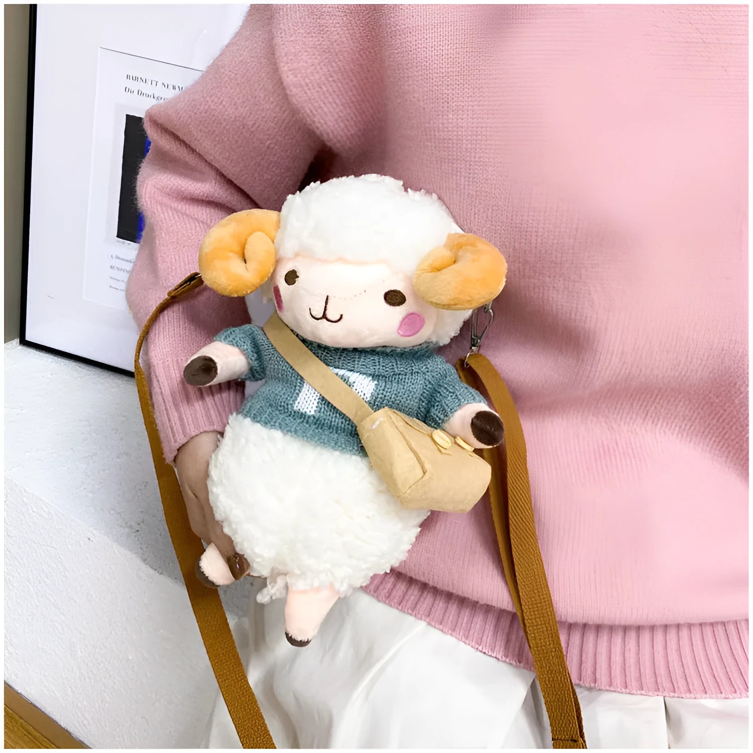 Little Sheep small square crossbody bag in blue plush fabric with a single shoulder strap and zip.