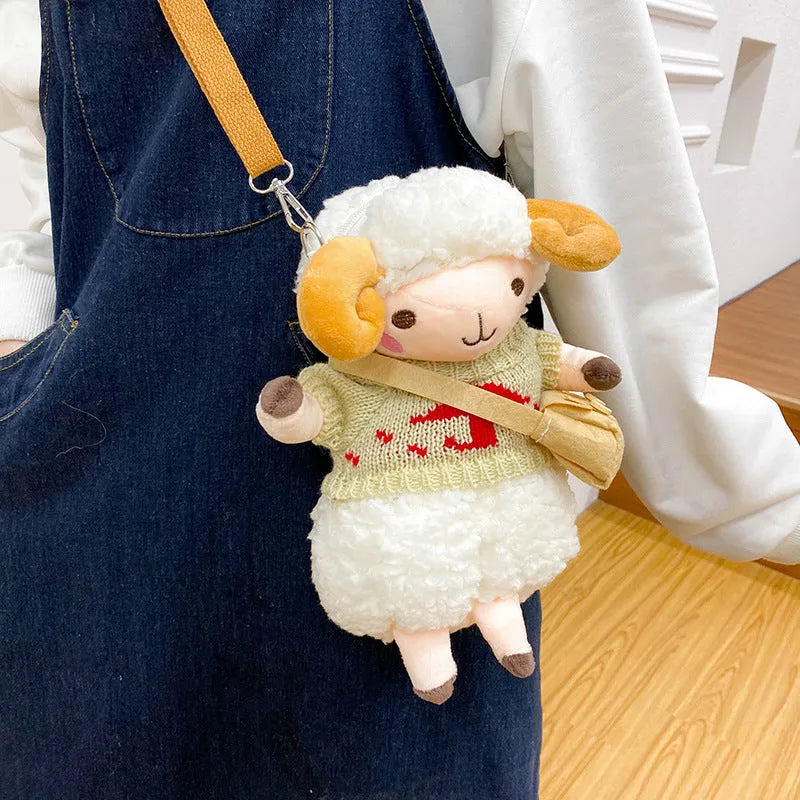 Little Sheep small square crossbody bag in blue plush fabric with a single shoulder strap and zip.