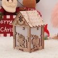 Three wooden Christmas decorations: log bell and two character houses in natural wood colour