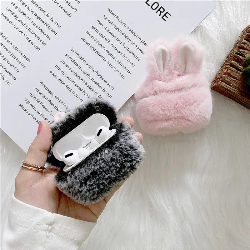 Pink silicone AirPods protective cover with grey plush rabbit ears design