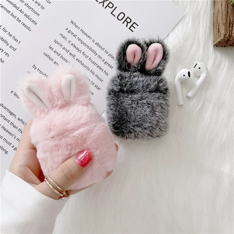 Pink silicone AirPods protective cover with grey plush rabbit ears design