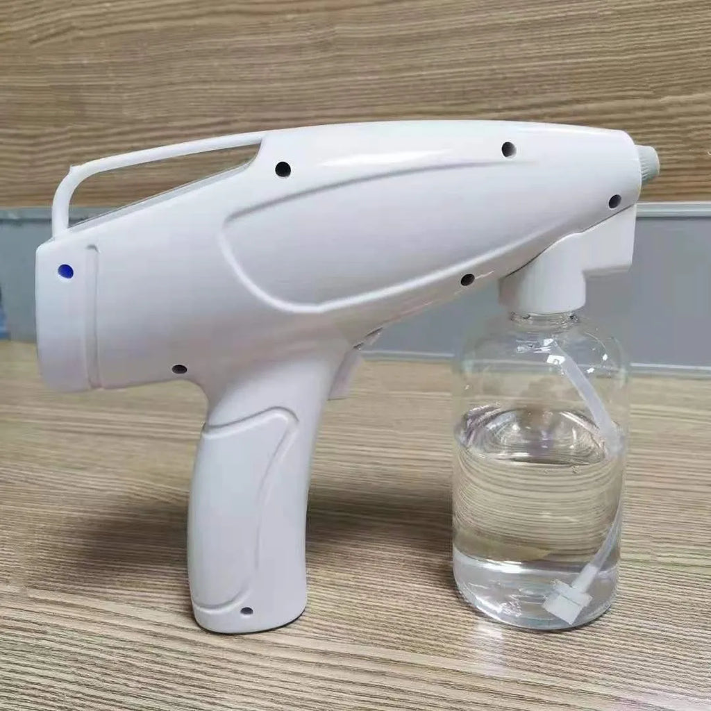 White handheld cordless electric disinfection sprayer with spray bottle.