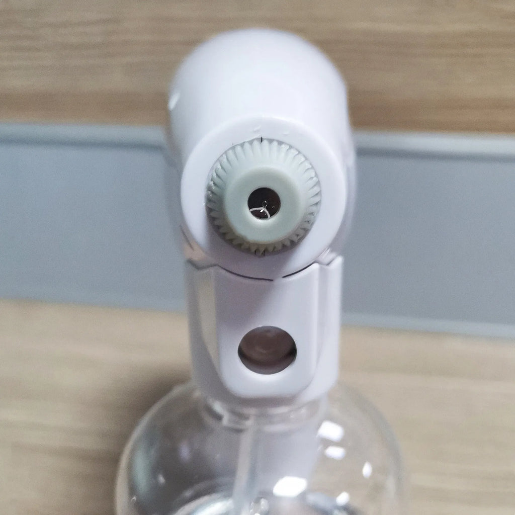 White handheld cordless electric disinfection sprayer with spray bottle.