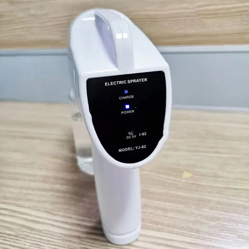 White handheld cordless electric disinfection sprayer with spray bottle.