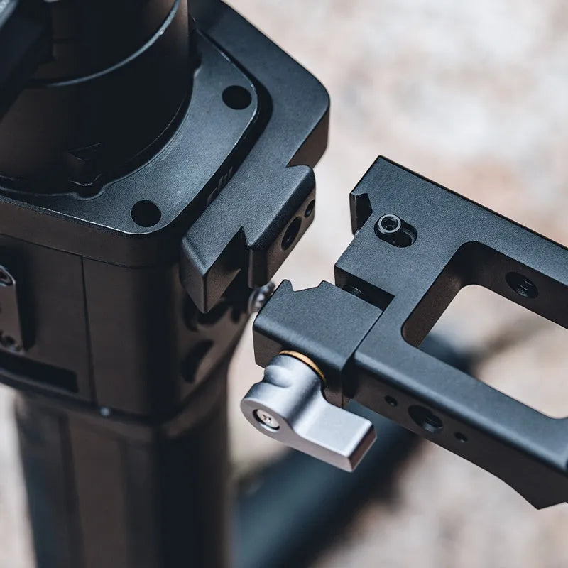 PGYTECH aluminium gimbal adapter for DJI Ronin S and SC on a tripod with accessory mounts visible.