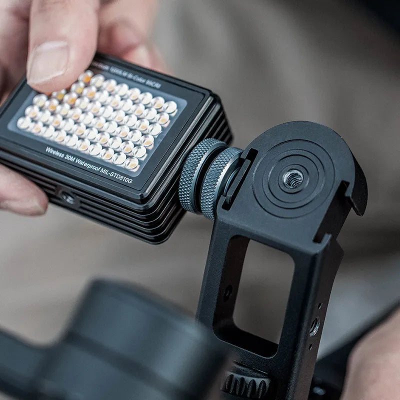 PGYTECH aluminium gimbal adapter for DJI Ronin S and SC on a tripod with accessory mounts visible.