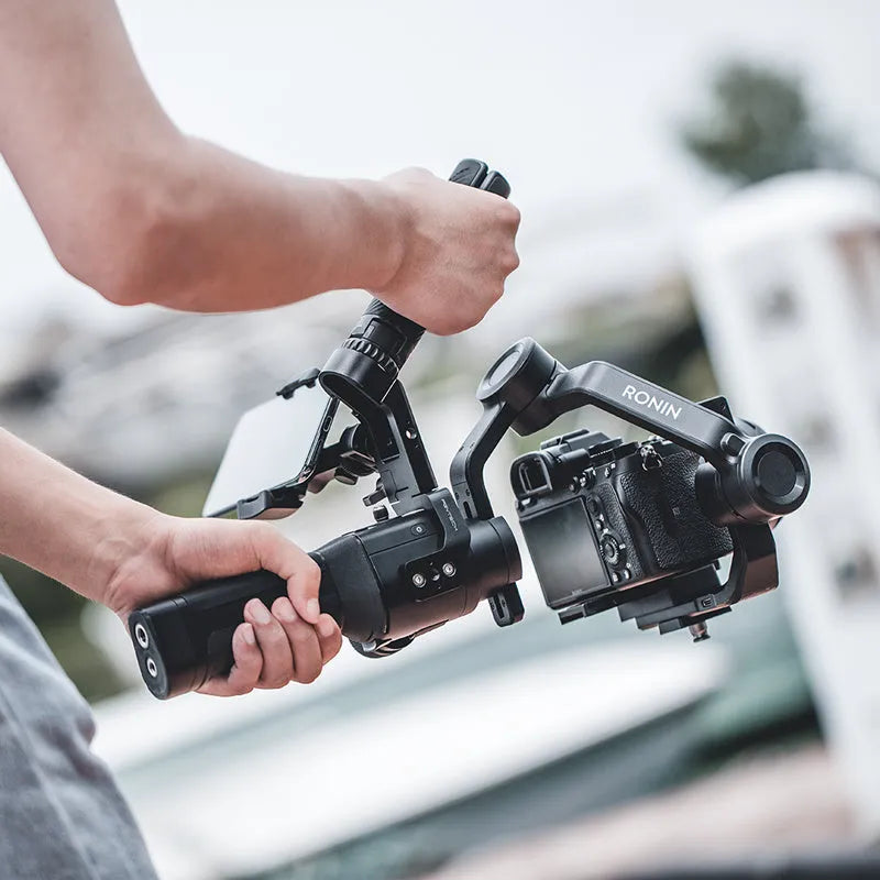 PGYTECH aluminium gimbal adapter for DJI Ronin S and SC on a tripod with accessory mounts visible.