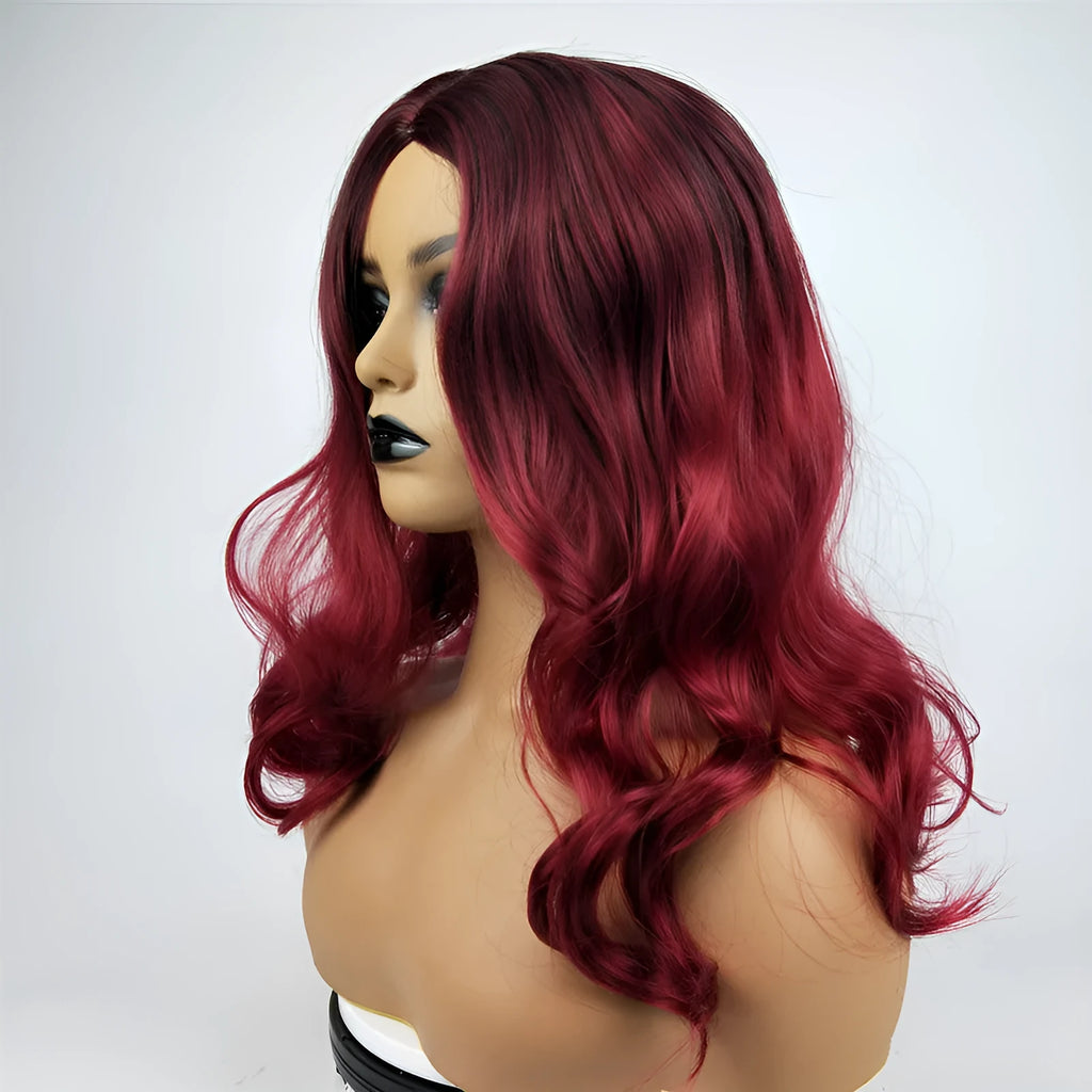 Burgundy long curly wig with gradient colour and centre bangs on a wig stand