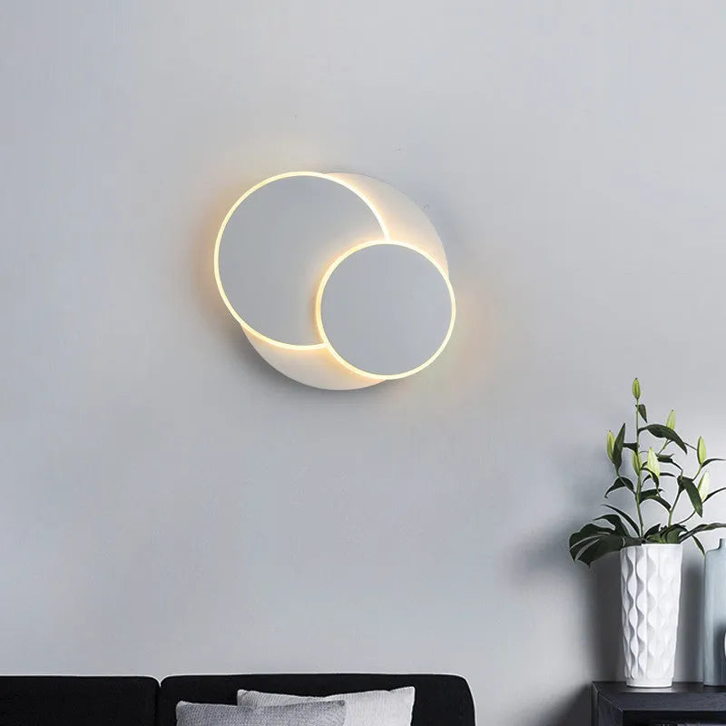 Modern round wall lamp in black or white with LED light and three size options
