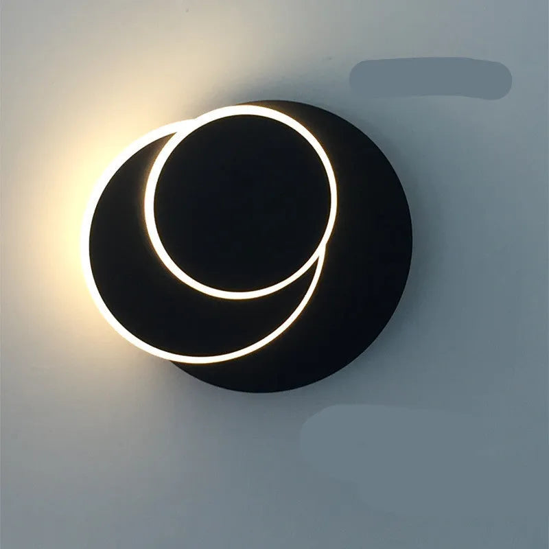 Modern round wall lamp in black or white with LED light and three size options