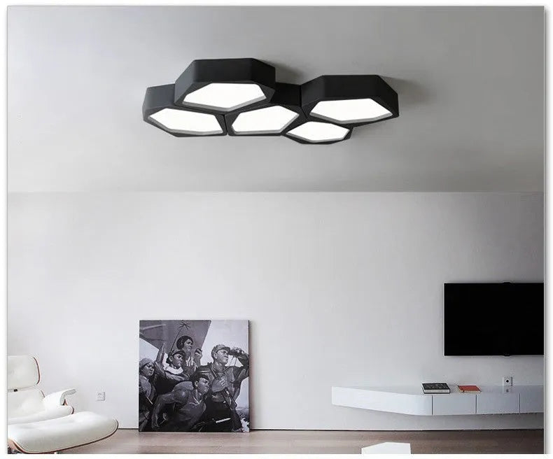 Geometric iron shade wall light with LED illumination in black or white frame