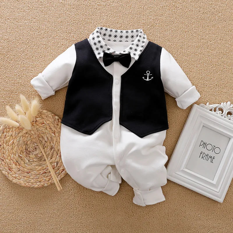 Gentleman-style baby jumpsuit in navy blue cotton, shown on a mannequin with long sleeves.